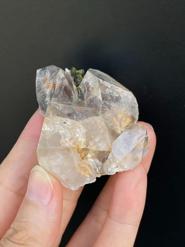 Clear garden quartz with green epidote inclusions from Meigu, Sichuan, China, top view