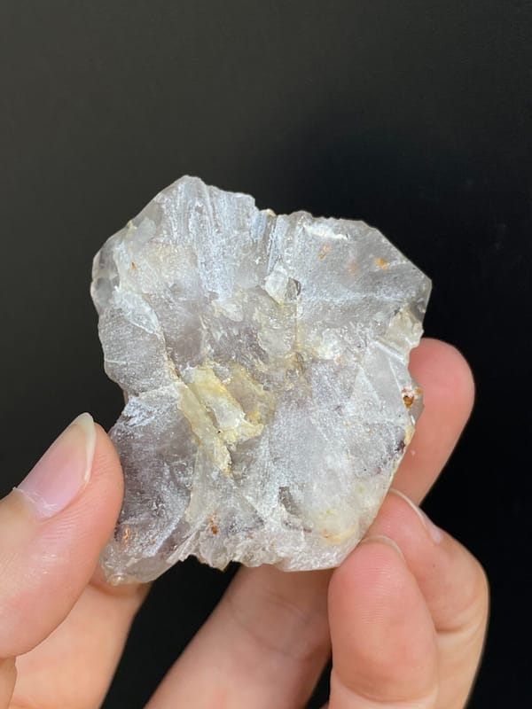 Clear garden quartz with green epidote inclusions from Meigu, Sichuan, China, close-up of terminations