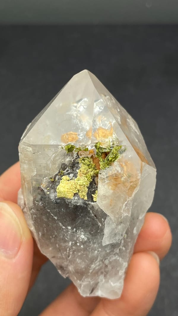 Large garden quartz crystal with epidote inclusions from Meigu, Sichuan, China