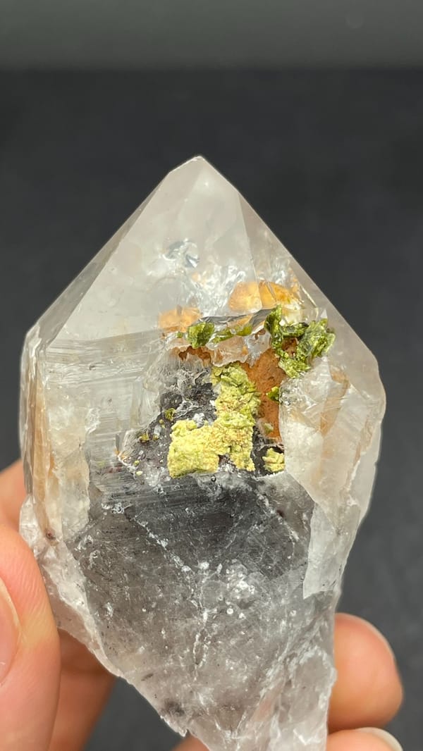 Large garden quartz crystal with epidote inclusions from Meigu, Sichuan, China, top view