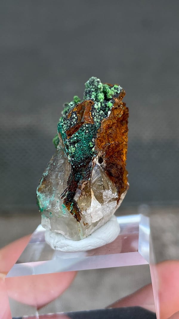 Grass-green conichalcite balls on quartz and matrix from Morocco, top view