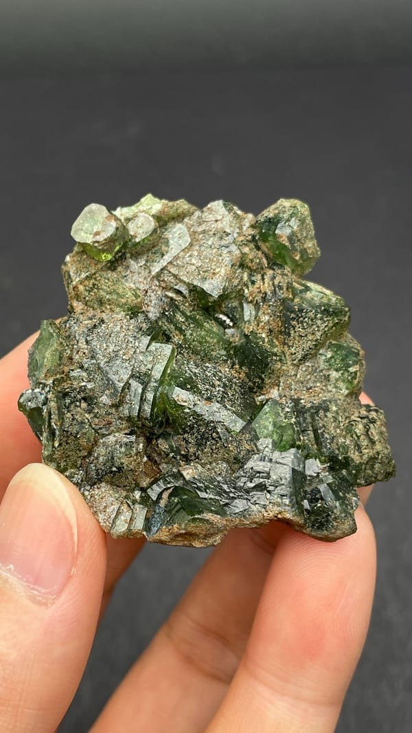 Apple-green ludlamite crystals on grey matrix from Brazil, second angle