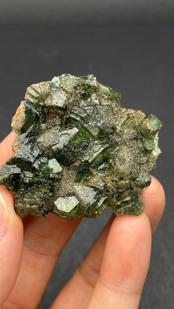 Apple-green ludlamite crystals on grey matrix from Brazil, top view