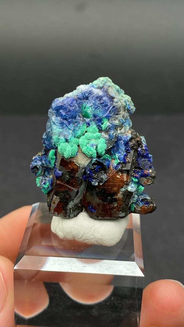 Blue azurite and green malachite rosettes on quartz from Morocco, close-up of the crystal faces