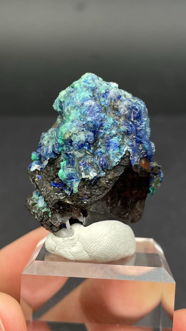 Blue azurite and green malachite rosettes on quartz from Morocco, detail of the matrix contact