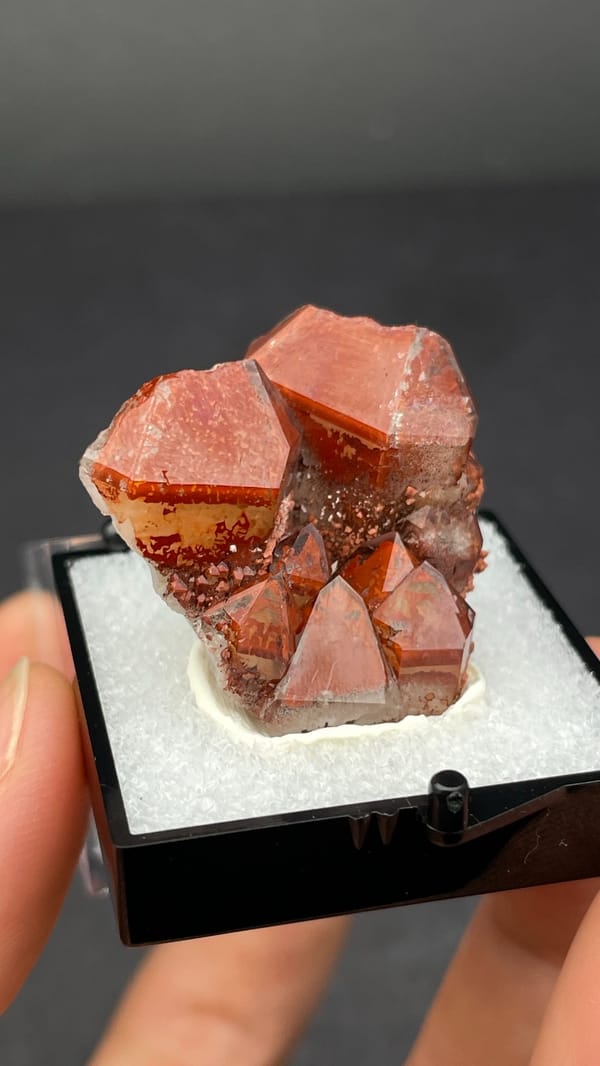 Deep red hematoid quartz crystals on matrix from Shanxi, China, in a perky box, second angle