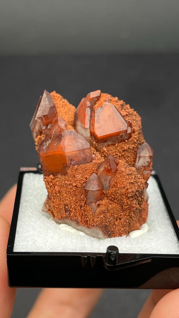 Red hematoid quartz with black specular hematite from Shanxi, China, in a perky box