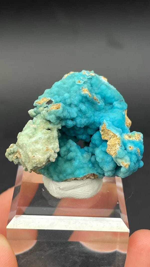 Turquoise botryoidal hemimorphite crust from Yunnan, China, on an acrylic stand