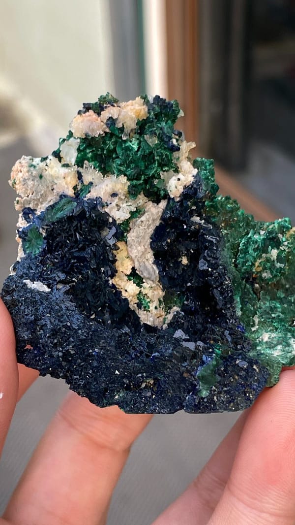 Deep blue azurite with green malachite pocket from Anhui, China, close-up of the crystal faces