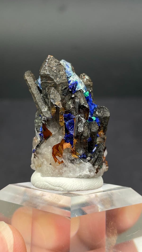 Blue azurite with green malachite sprays on matrix from Morocco, close-up of the crystal faces