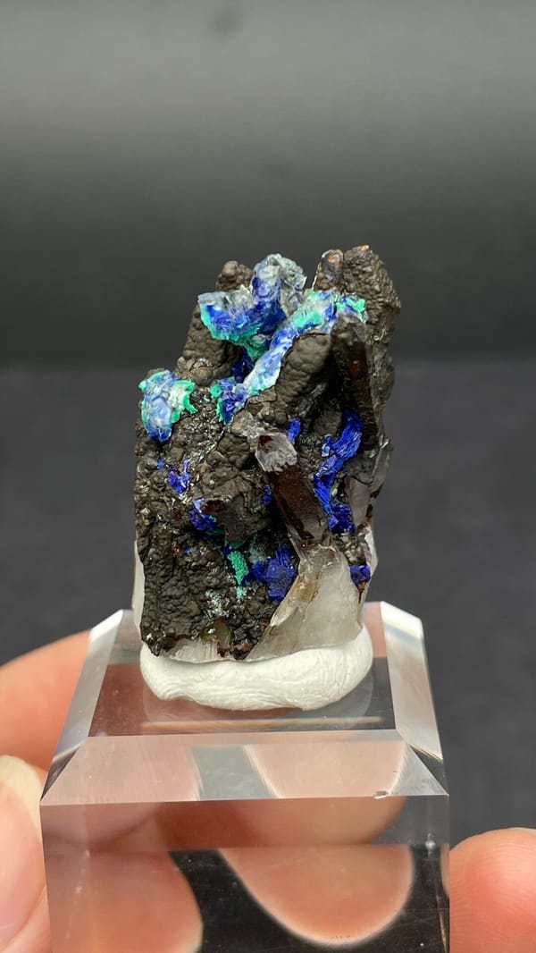 Blue azurite with green malachite sprays on matrix from Morocco, detail of the matrix contact