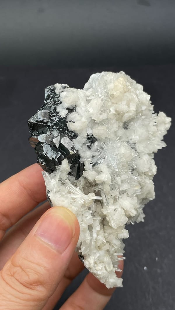 White quartz crust over dark marmatite sphalerite from Peru, second angle