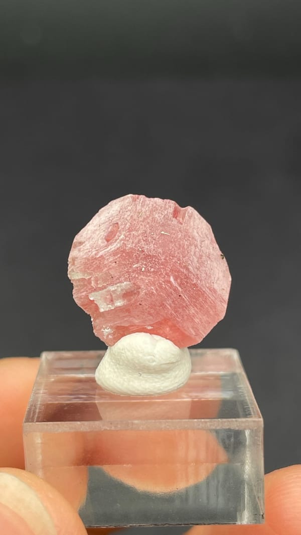 Pink rhodochrosite rosette on quartz from Wuzhou, Guangxi, China, reverse side