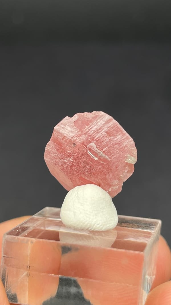 Pink rhodochrosite rosette on quartz from Wuzhou, Guangxi, China, detail of the matrix contact
