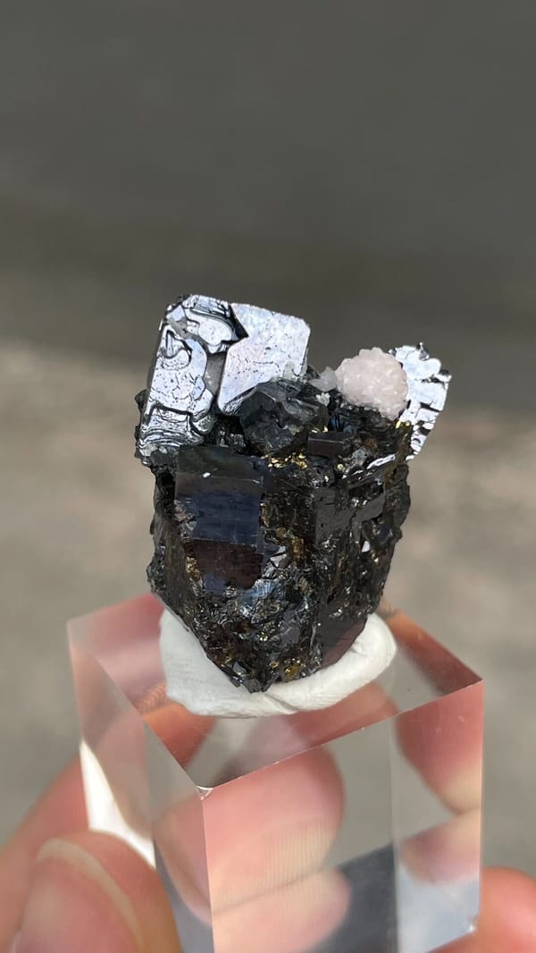 Metallic galena with chalcopyrite and pink rhodochrosite from Peru, top view