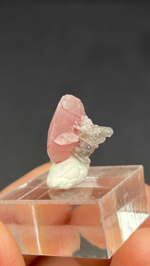 Rose-pink rhodochrosite shell on quartz from Wuzhou, Guangxi, China, reverse side
