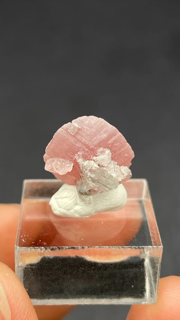 Rose-pink rhodochrosite shell on quartz from Wuzhou, Guangxi, China, detail of the matrix contact