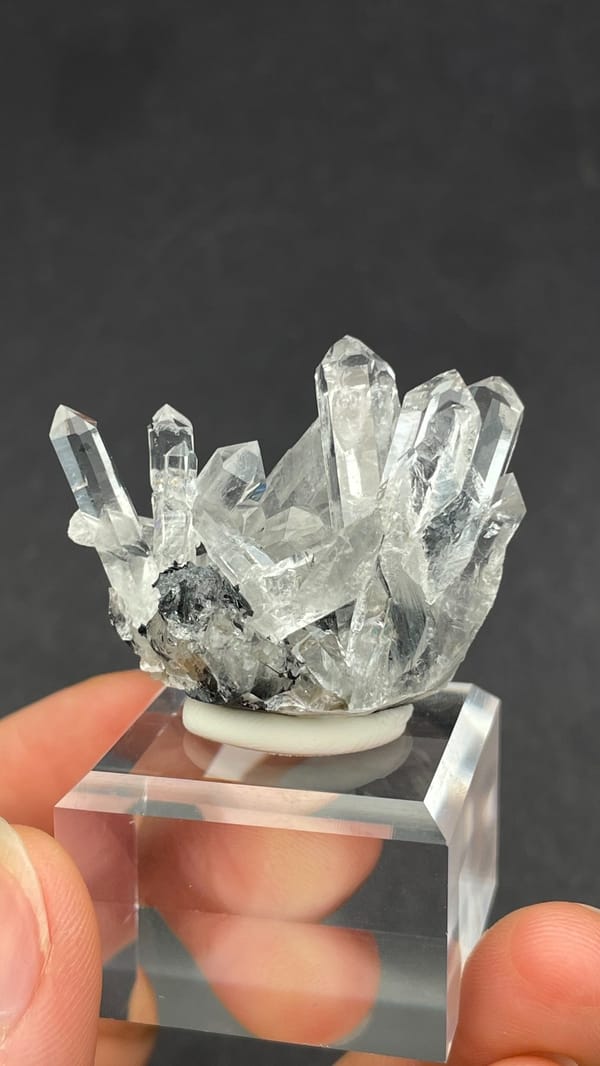 Long clear quartz points on specular hematite from Guangdong, China, second angle