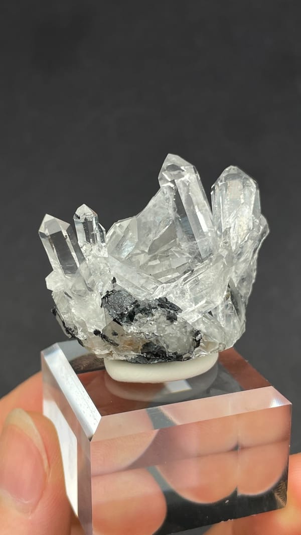 Long clear quartz points on specular hematite from Guangdong, China, top view
