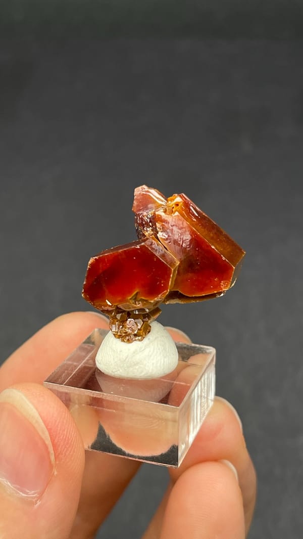 Dark red vanadinite crystal group from Morocco, on an acrylic stand, second angle