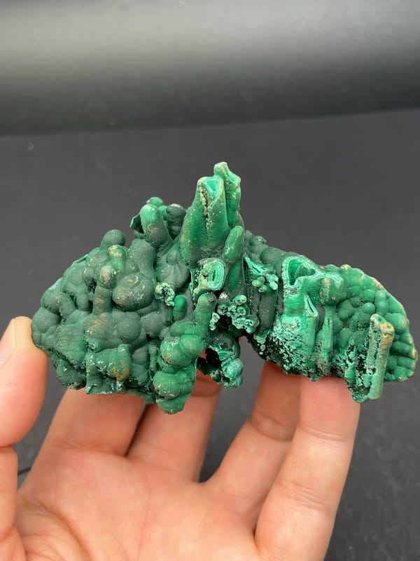 Emerald green botryoidal malachite from Yangchun, Guangdong, China, detail of the matrix contact