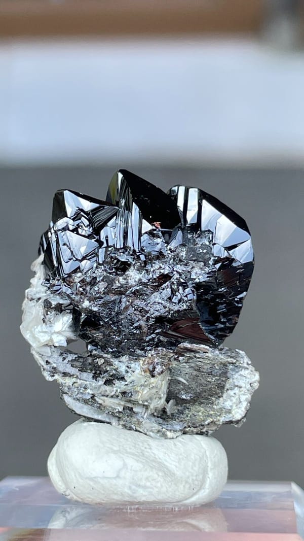 Black lustrous cassiterite crystal group on white matrix from Xuebaoding, Sichuan, second angle