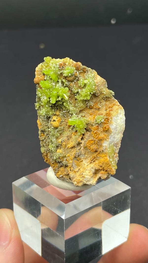 Yellow-green pyromorphite on ochre limonite matrix from Guangdong, China, close-up of the crystal faces