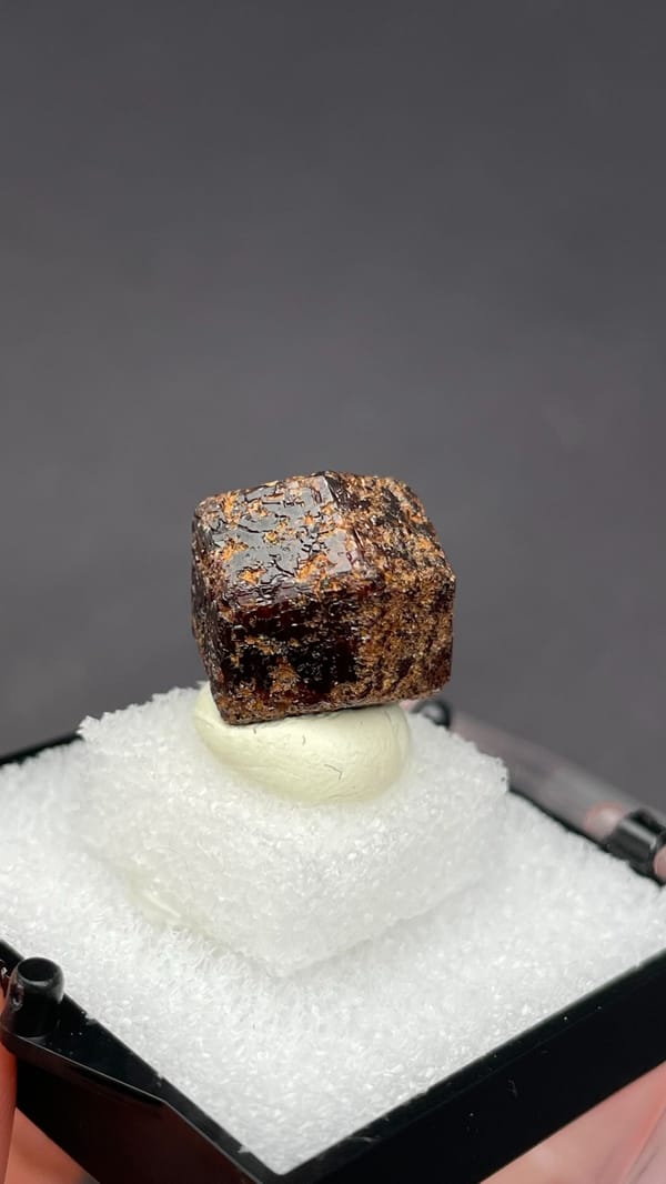 Dark brown dodecahedral andradite garnet crystal from Handan, Hebei, China, reverse side