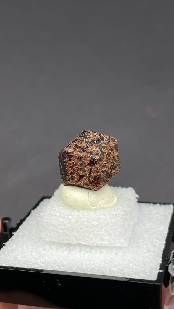 Dark brown dodecahedral andradite garnet crystal from Handan, Hebei, China, top view