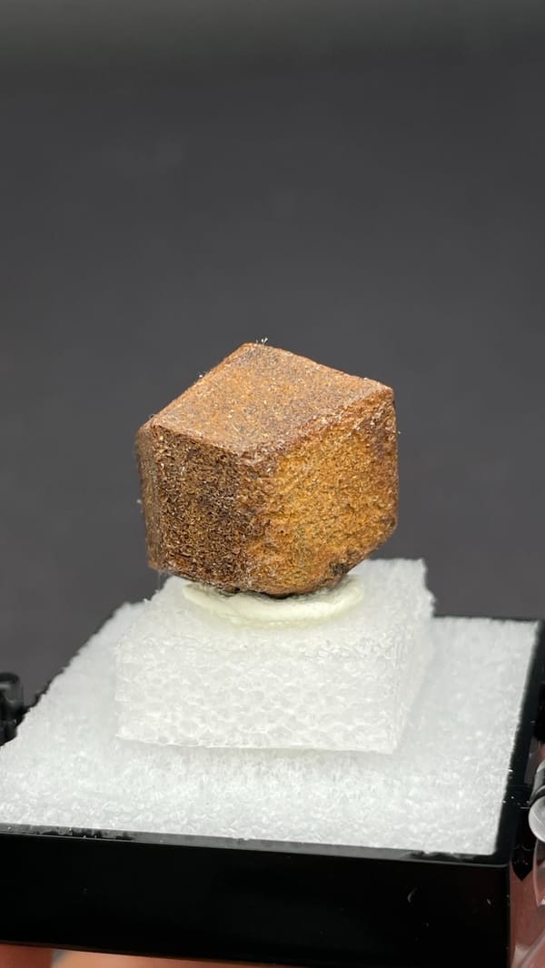 Brown dodecahedral andradite garnet single crystal from Handan, Hebei, China, close-up of the crystal faces
