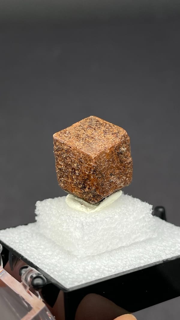 Brown dodecahedral andradite garnet single crystal from Handan, Hebei, China, reverse side