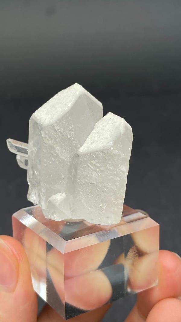 Blocky white baryte crystal with quartz from Jinkouhe, Sichuan, China, close-up of the crystal faces