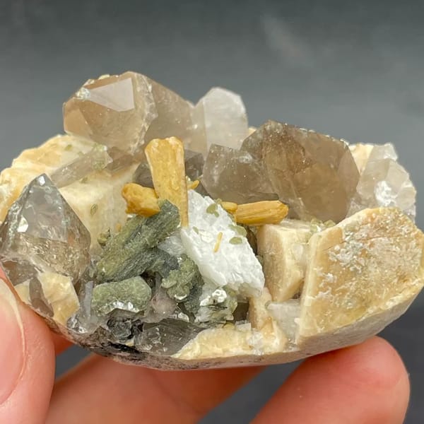 Smoky quartz with golden stilbite, mica and feldspar from Fujian — complete view