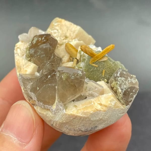 Smoky quartz with golden stilbite, mica and feldspar from Fujian — detail view