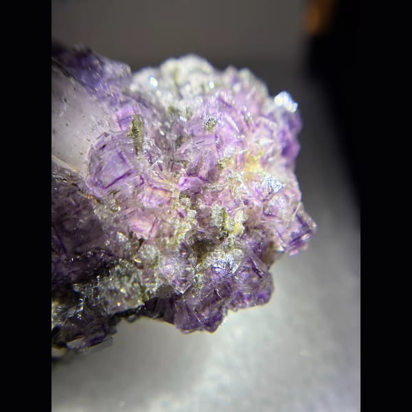 Purple fluorite with an upright quartz point and chlorite from Yaogangxian — alternate view