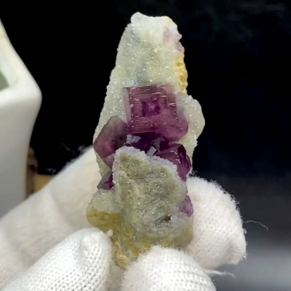 Magenta fluorite cube with fret patterning on white matrix from Anhui, China