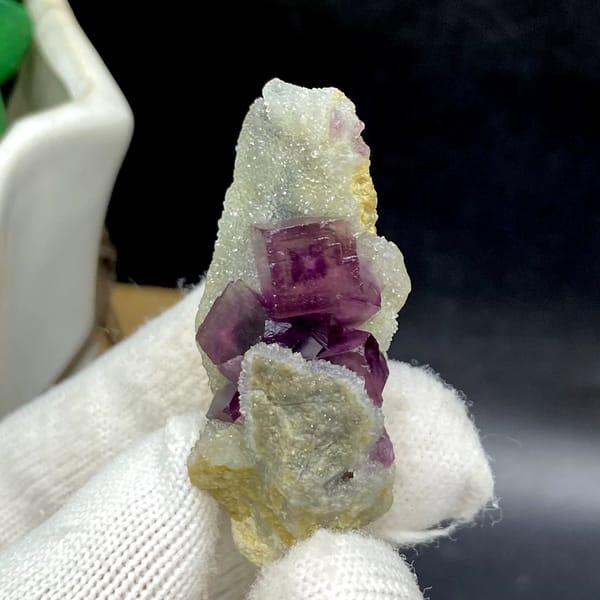 Magenta fluorite cube with fret patterning on white matrix from Anhui, China, view 2 of 9