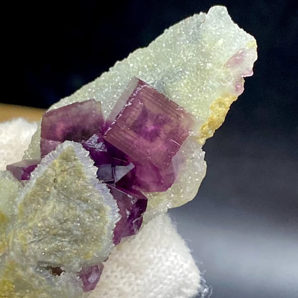 Magenta fluorite cube with fret patterning on white matrix from Anhui, China, view 4 of 9