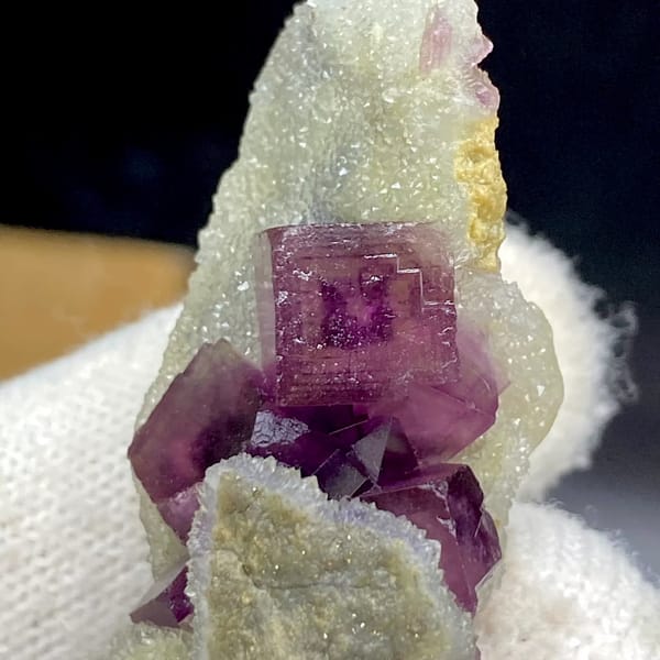Magenta fluorite cube with fret patterning on white matrix from Anhui, China, view 5 of 9