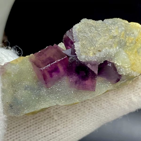 Magenta fluorite cube with fret patterning on white matrix from Anhui, China, view 6 of 9