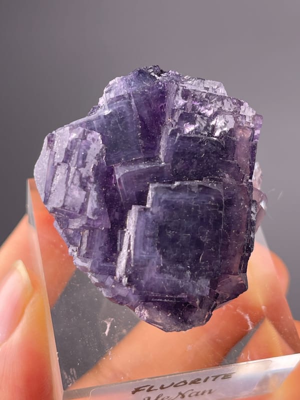 Purple Fluorite specimen from Henan, China displaying terraced purple cubic cluster
