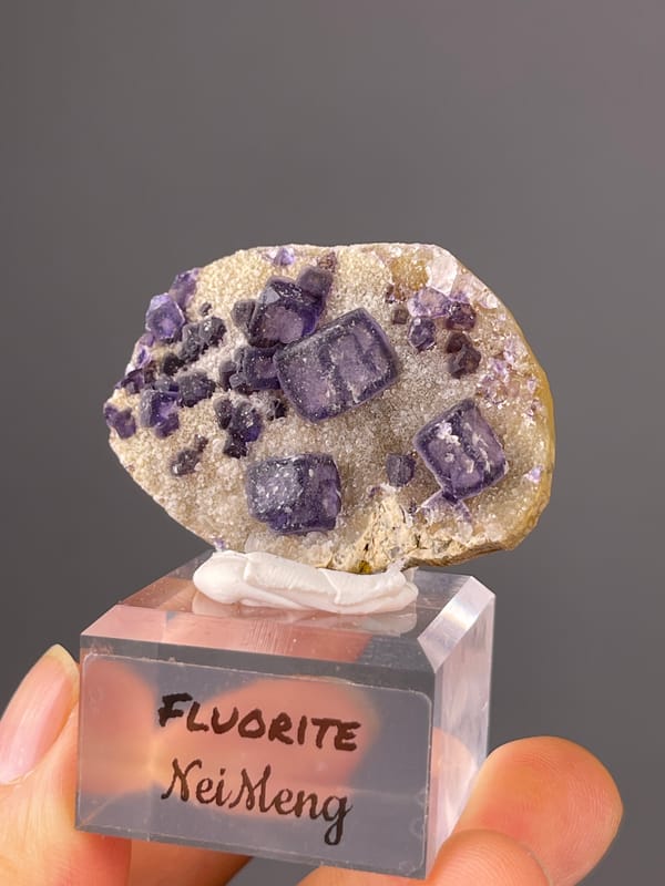 Purple cubes on pale matrix visible on purple fluorite specimen from Inner Mongolia, China