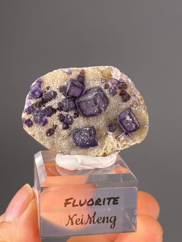Purple cubes on pale matrix on natural purple fluorite specimen from Inner Mongolia, China