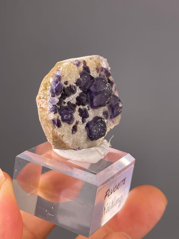 Purple Fluorite specimen from Inner Mongolia, China highlighting purple cubes on pale matrix