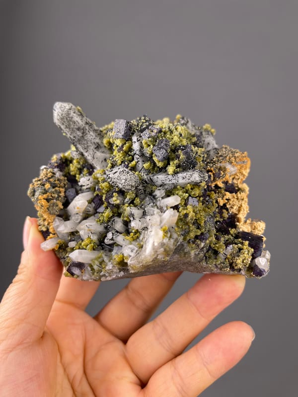 Purple Fluorite specimen from Yaogangxian Mine, Hunan, China showing included clear quartz and purple cubes