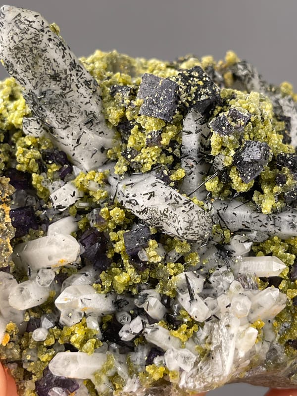 Purple Fluorite specimen from Yaogangxian Mine, Hunan, China displaying included clear quartz and purple cubes
