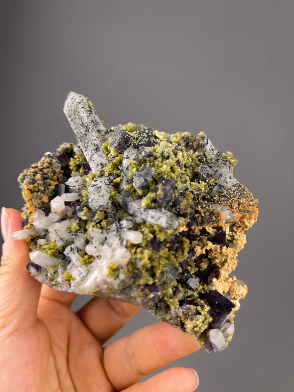 Purple Fluorite specimen from Yaogangxian Mine, Hunan, China highlighting included clear quartz and purple cubes