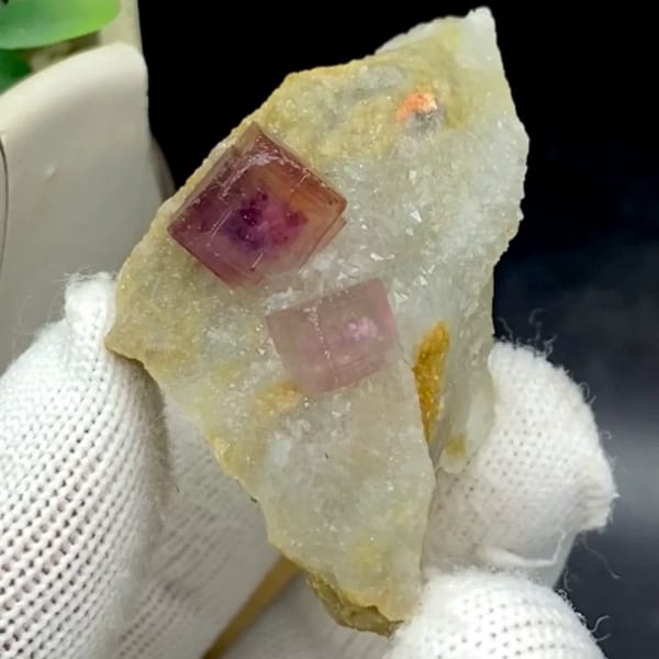 Two magenta fluorite cubes on pale quartz plate from Anhui, China