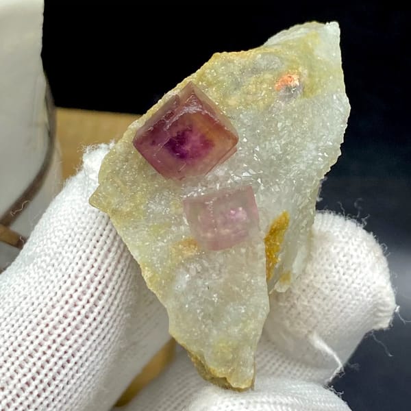 Two magenta fluorite cubes on pale quartz plate from Anhui, China, view 2 of 9