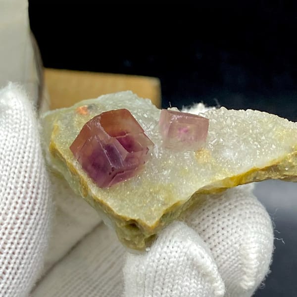 Two magenta fluorite cubes on pale quartz plate from Anhui, China, view 8 of 9